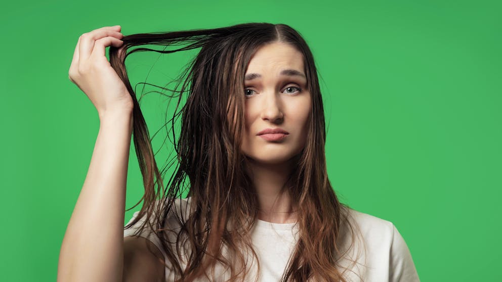 Woman with greasy hair