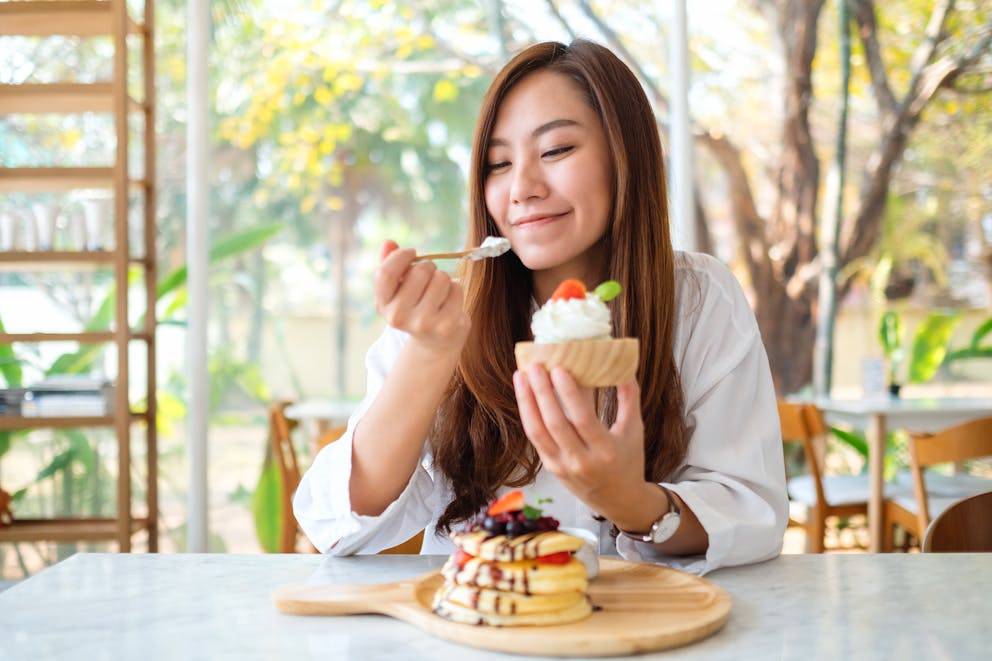 Woman eating whipped cream