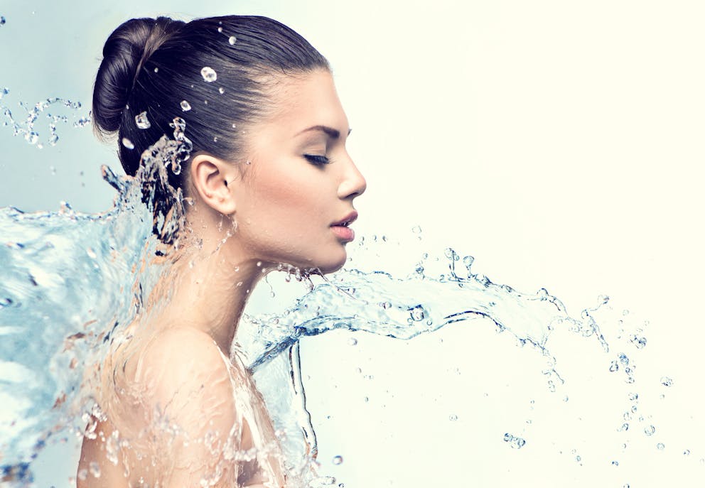 Woman with water splashes