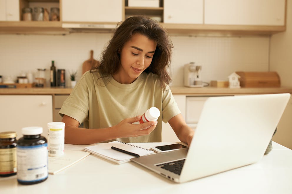 Woman reading product label