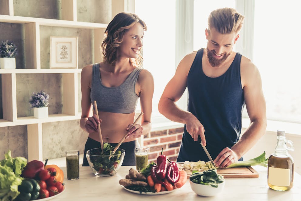 Healthy couple preparing healthy food