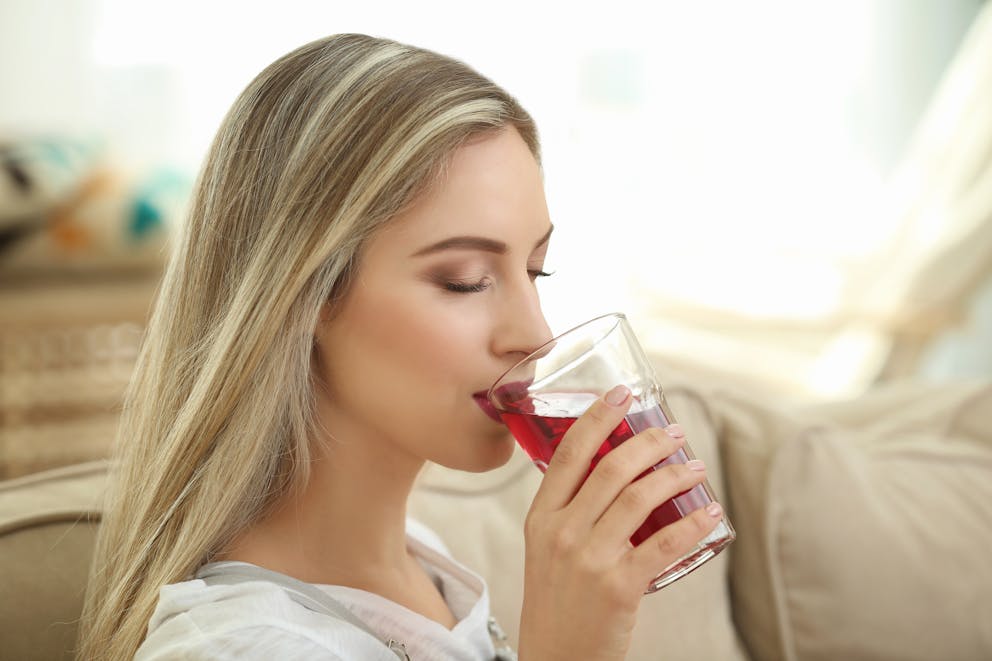 Woman drinking hibiscus tea