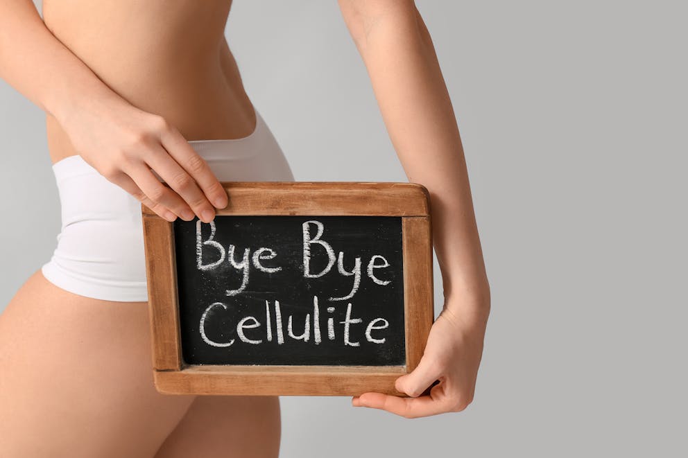 Girl with bye cellulite sign