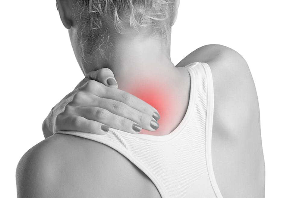 Black and white photo of woman with hand on back of neck and shoulder, muscle pain shown in red.