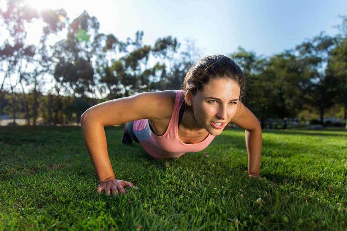 Woman doing push up | 5 Tricks to Make Intermittent Fasting Work Faster