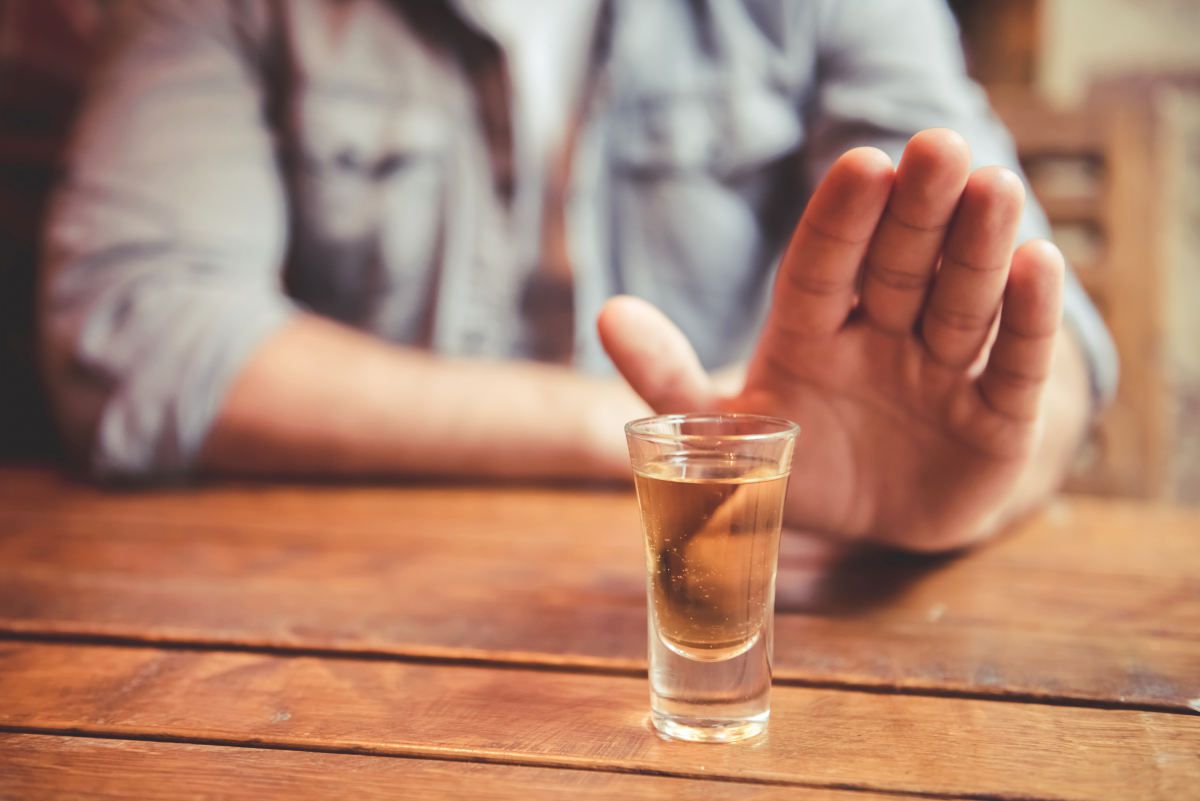 Cropped image of man showing stop gesture and refusing to drink | Can You Drink Coffee With Intermittent Fasting? And Other Acceptable Liquids