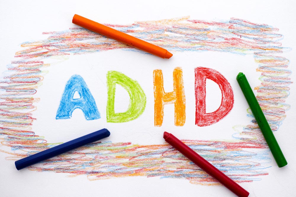 ADHD written on a piece of paper with colored crayons | ADHD Is a Nutritional Problem, Not a Mental One