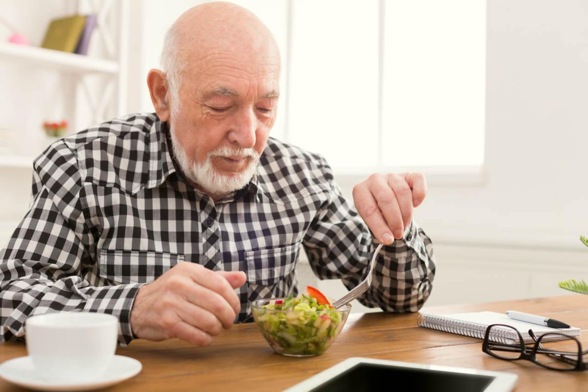 Senior man eating fresh salad | The Best Thing To Do If You Have Bone On Bone Knees | Have Bone On Bone Knee | natural treatment for bone on bone knee
