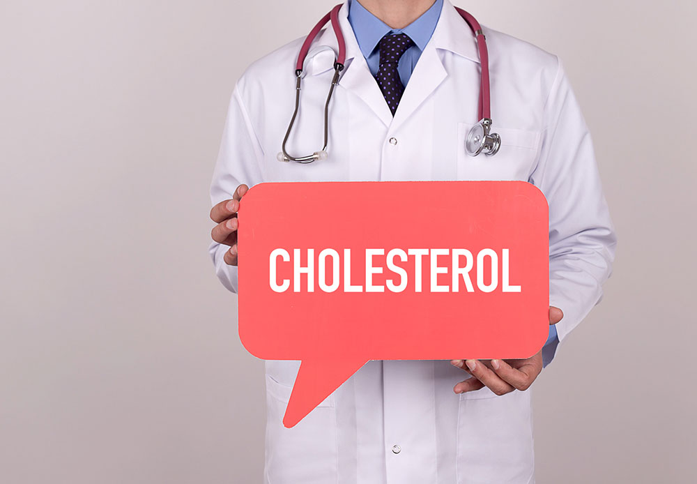a drawing of a doctor in a white coat holding a sign saying cholesterol