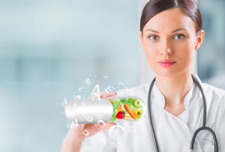 Woman doctor with eye vitamins and healthy fruits and vegetables