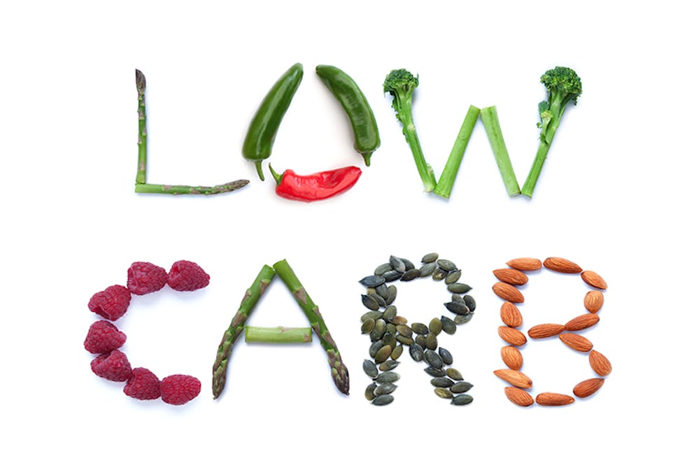 the words low carb spelled out with low carb fruits and nuts low-carb-sign