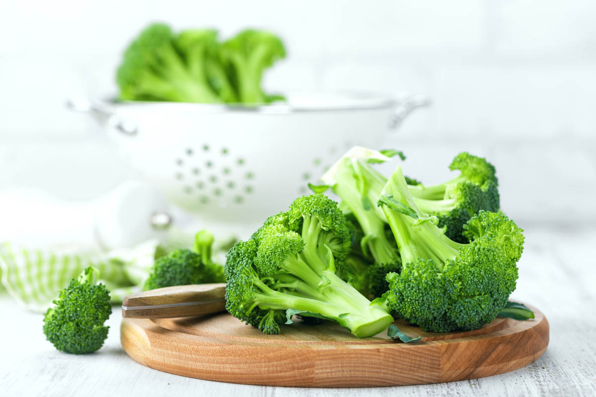Fresh broccoli on white background closeup | How to Detox GMO Chemicals From Your Body [INFOGRAPHIC]