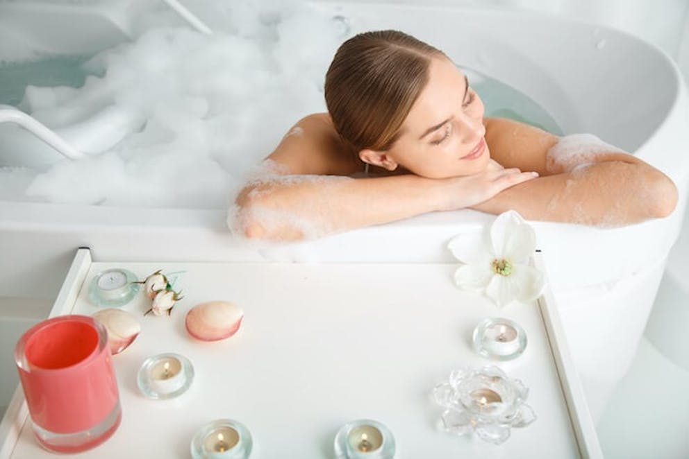 woman in a relaxation mineral bath to reduce stress | Do This for Stress Now