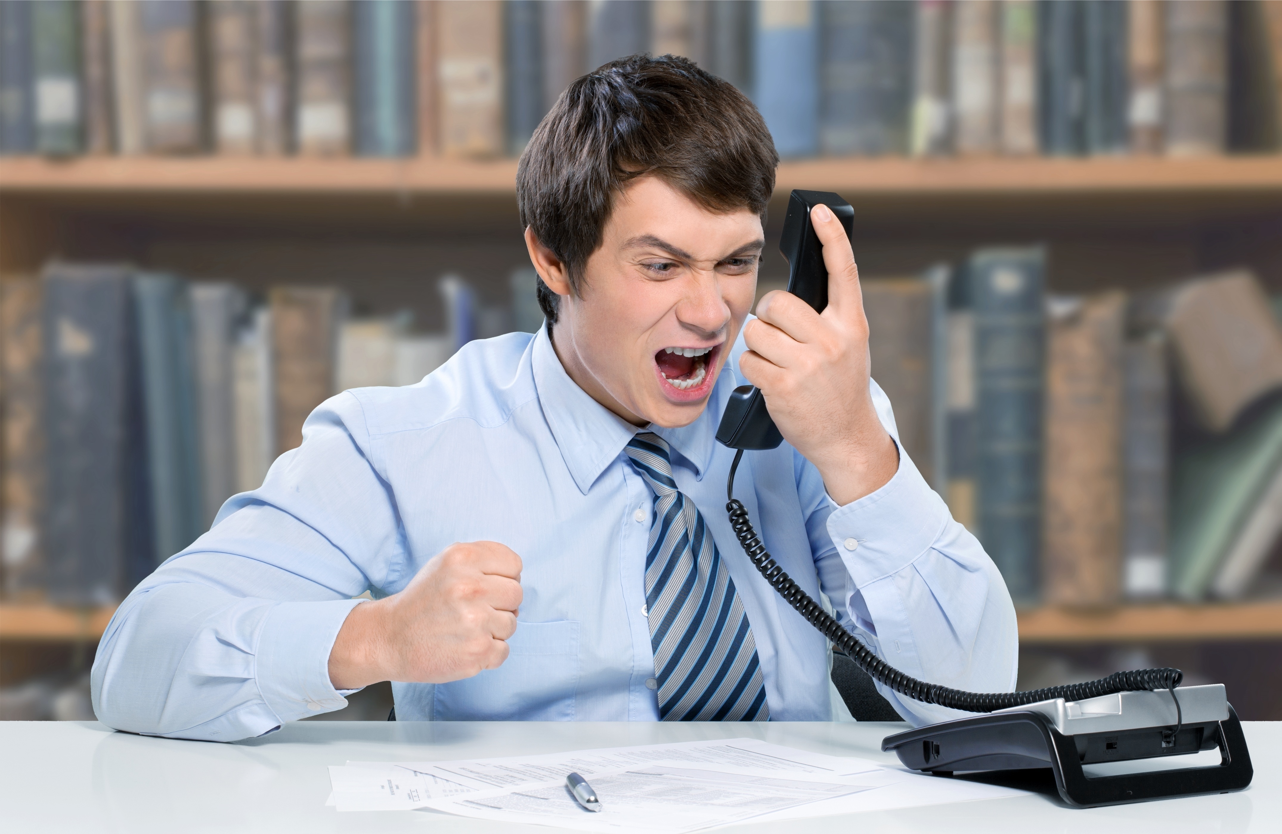 Man screaming into phone