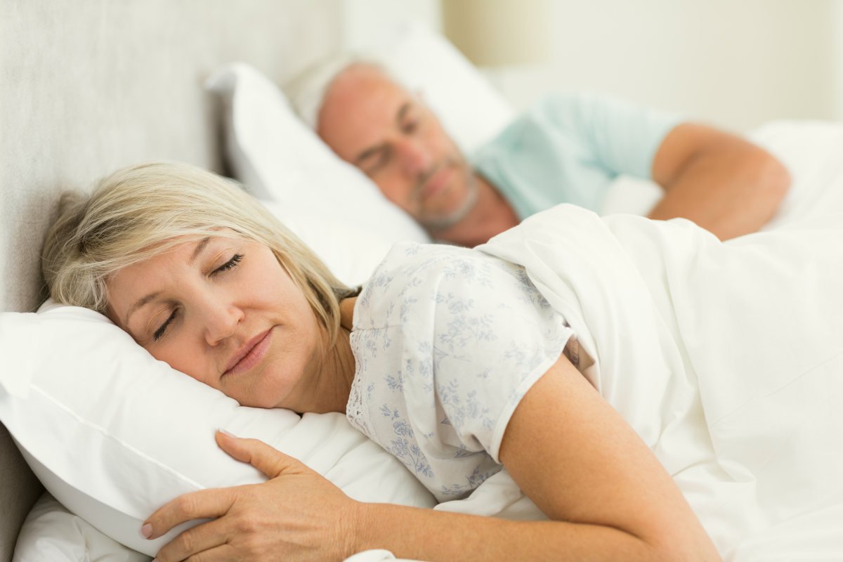 Mature couple sleeping | What Causes Excess Urination at Night (Nocturia) and How To FIX It | what causes excessive urination
