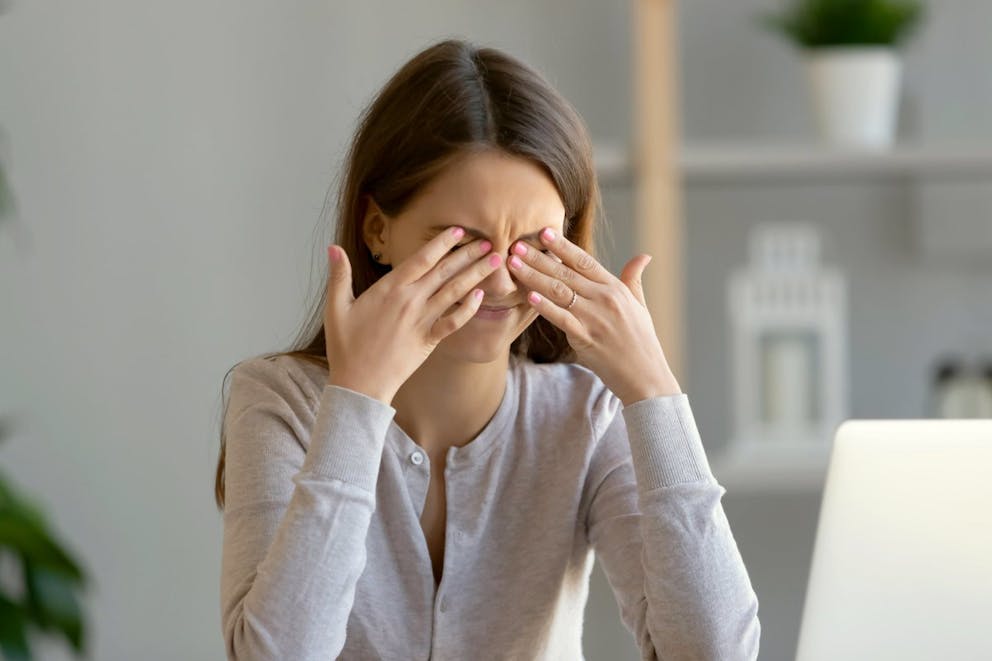 Tired teen girl rubbing dry irritable eyes | Two Causes Of Eye Twitching, Especially Under The Left Eyelid | why is my eye twitching