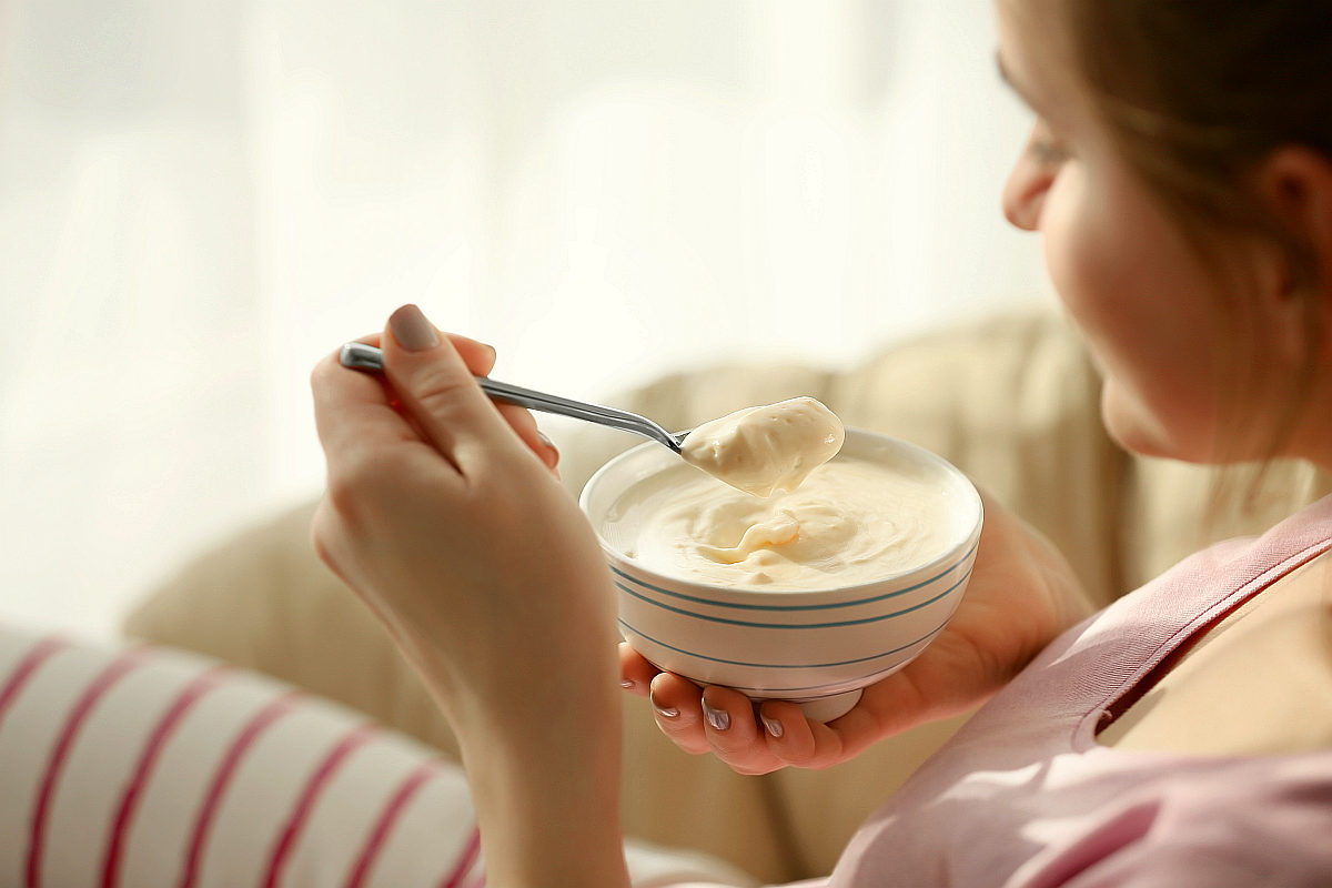 Bowl yogurt spoon female hands | Fermented Foods on Keto