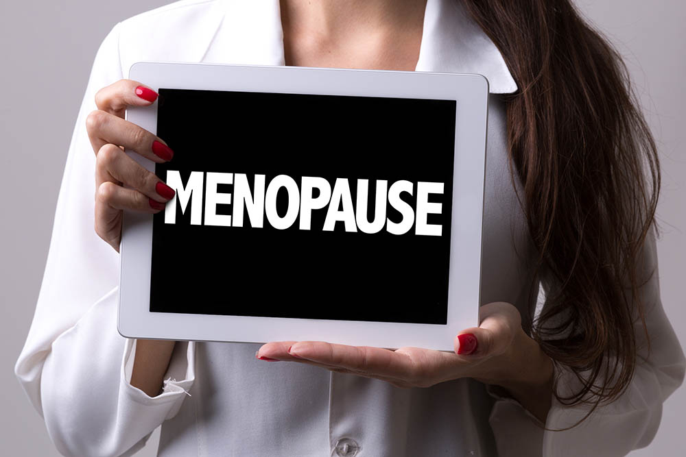 Woman Holding Menopause Signboard