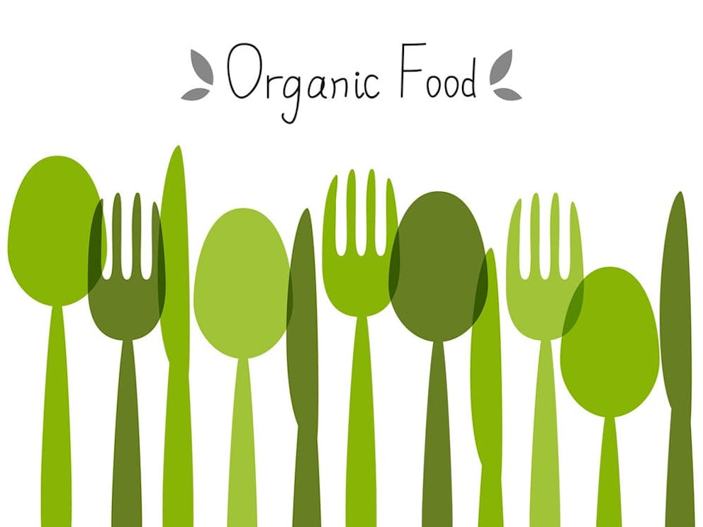 Organic food concept, green silverware images with label for organic food on white background.