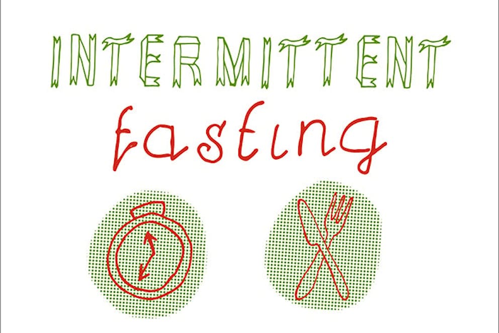 a hand-lettered sign that reads intermittent fasting