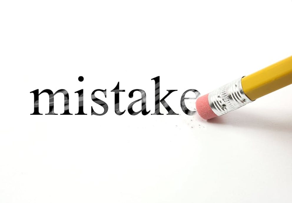 A sign saying Mistakes with an eraser symbolizing erasing your mistakes