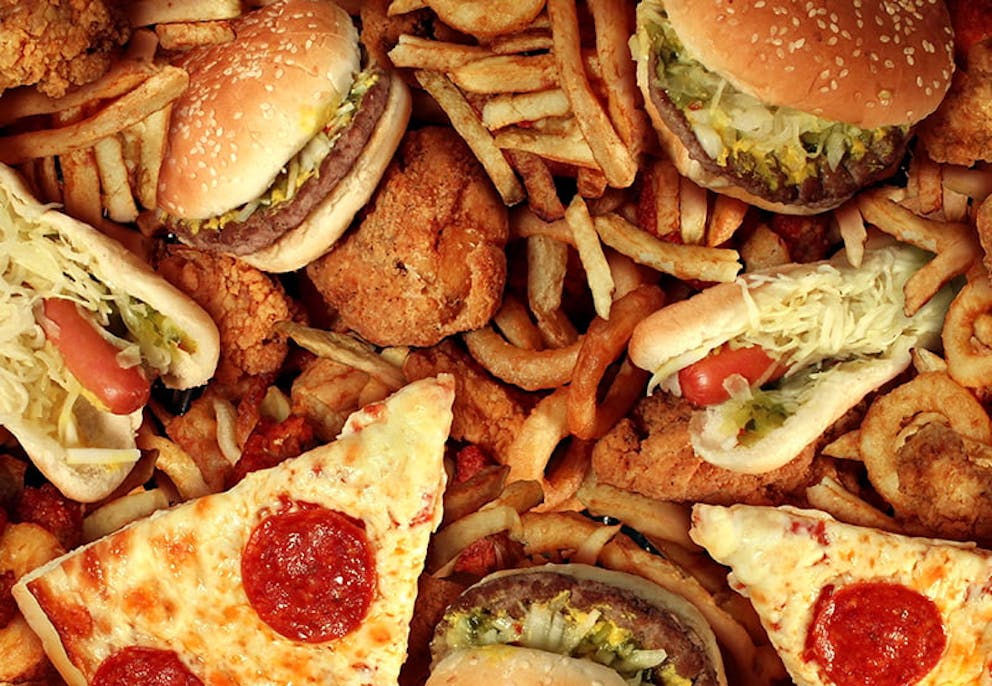 A picture of common junk foods like burgers and pizza