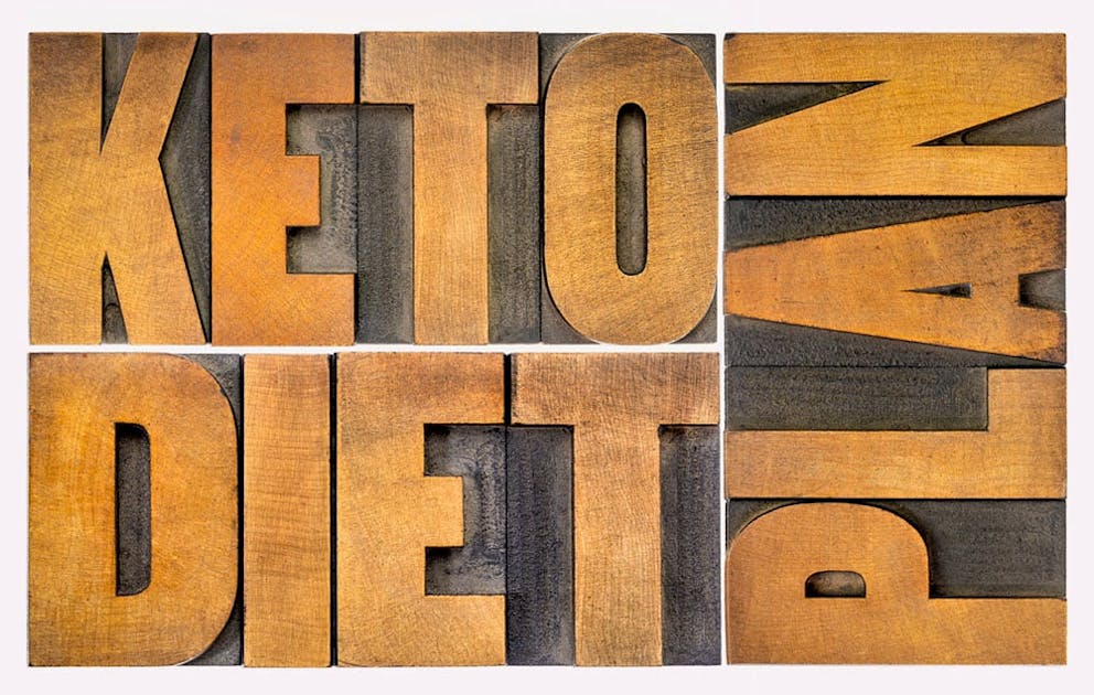 Wooden letters spell Keto Diet Plan, low-carb diet.