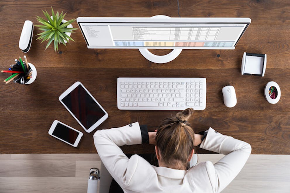 Woman asleep on a desk at work after lunch | Sleepy After Lunch Your SIESTA Means You Have