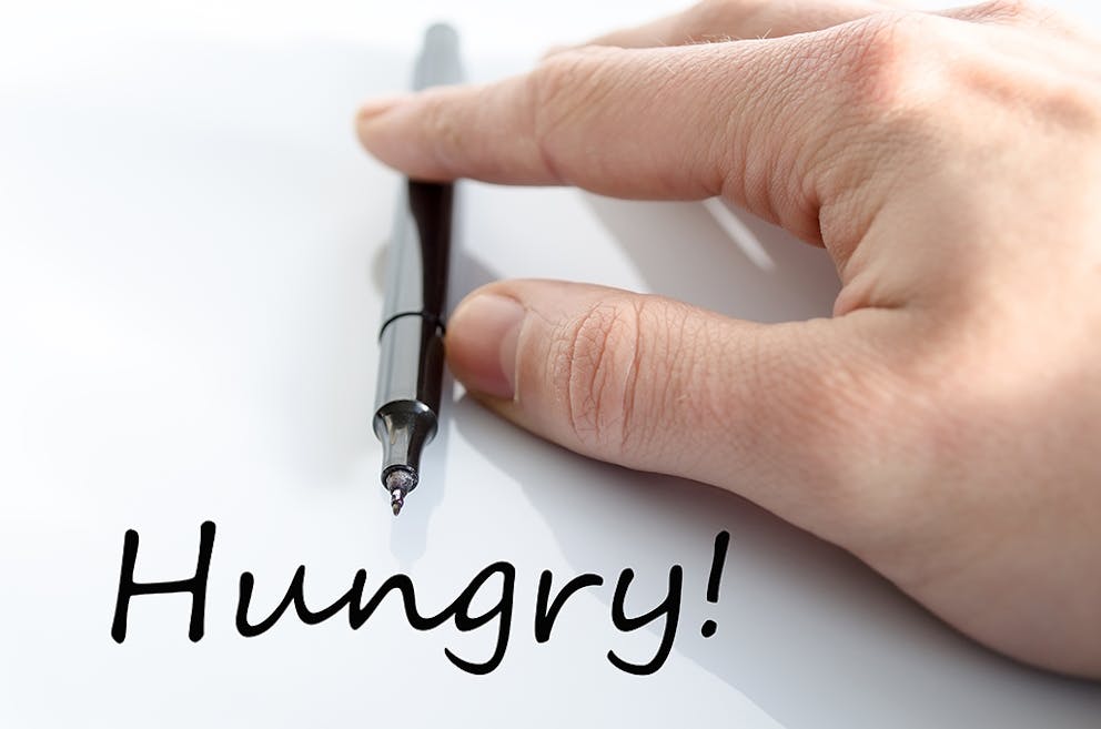a handwritten sign that says Hungry!
