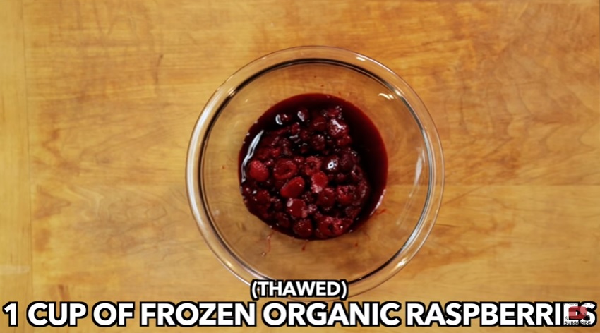 Cup of frozen organic raspberries