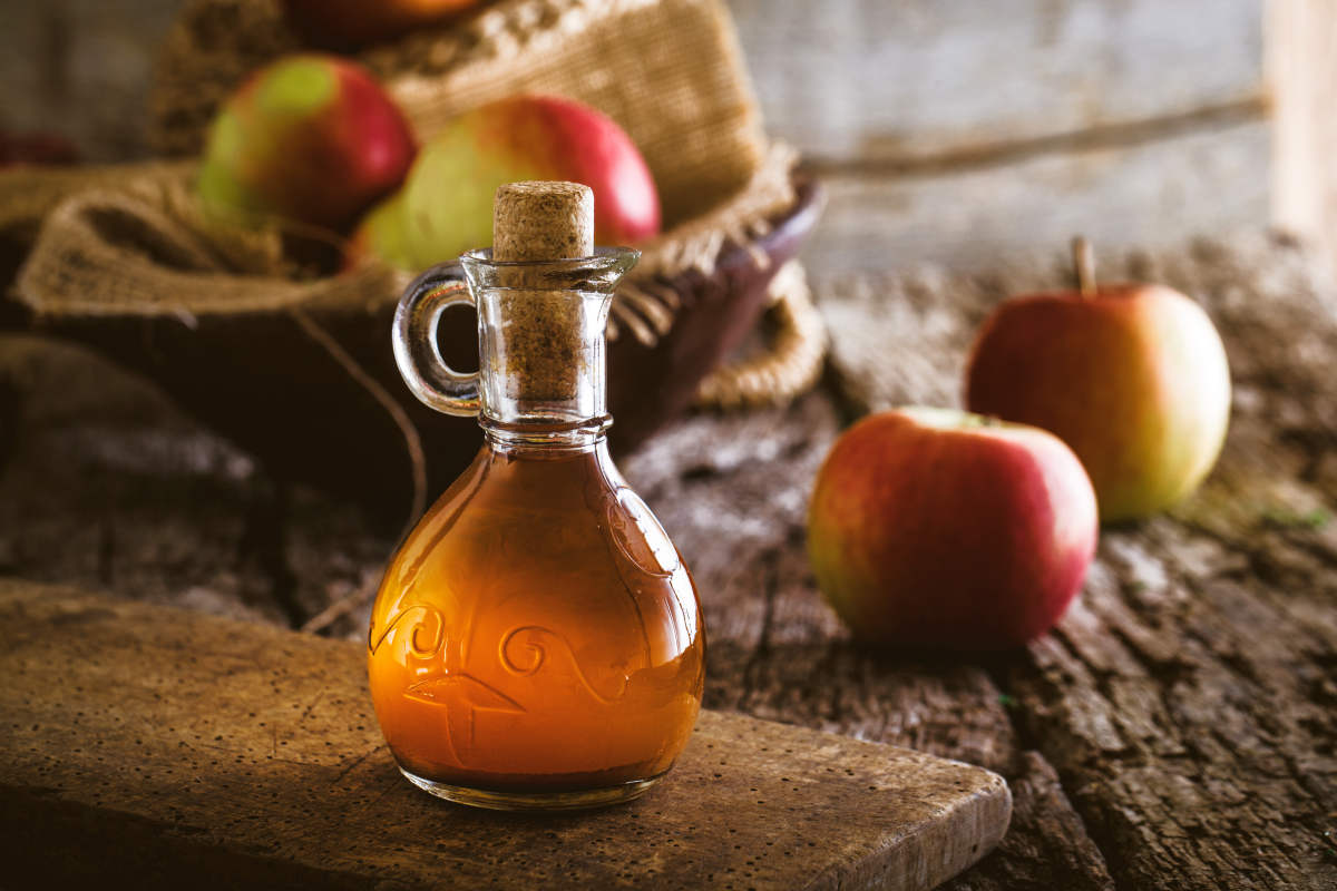 Bottle of apple organic vinegar | The Dangers Of Using Baking Soda: Sodium Bicarbonate Hazards