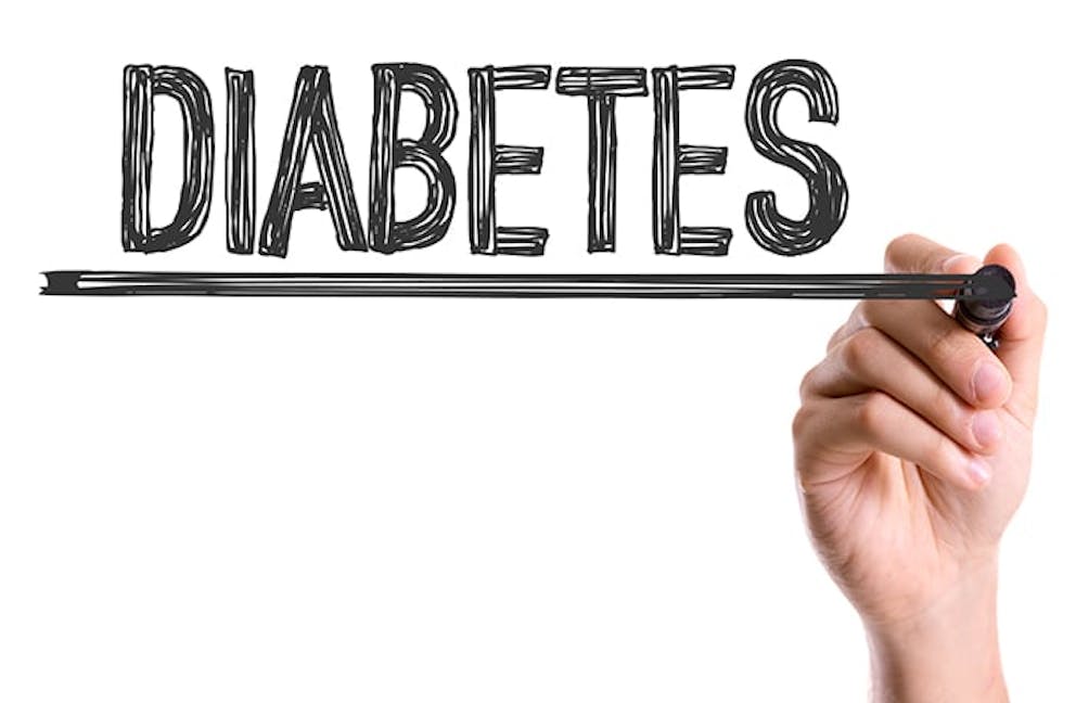 a hand-lettered sign that says Diabetes in black letters on a white background