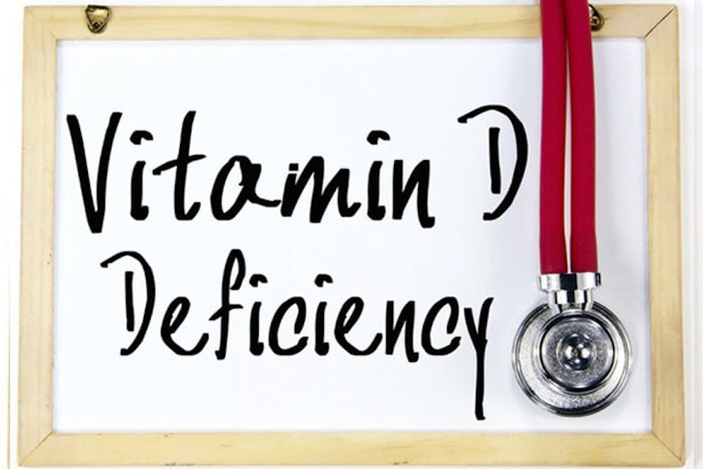 Vitamin D Deficiency written on whiteboard in black pen with stethoscope hanging.