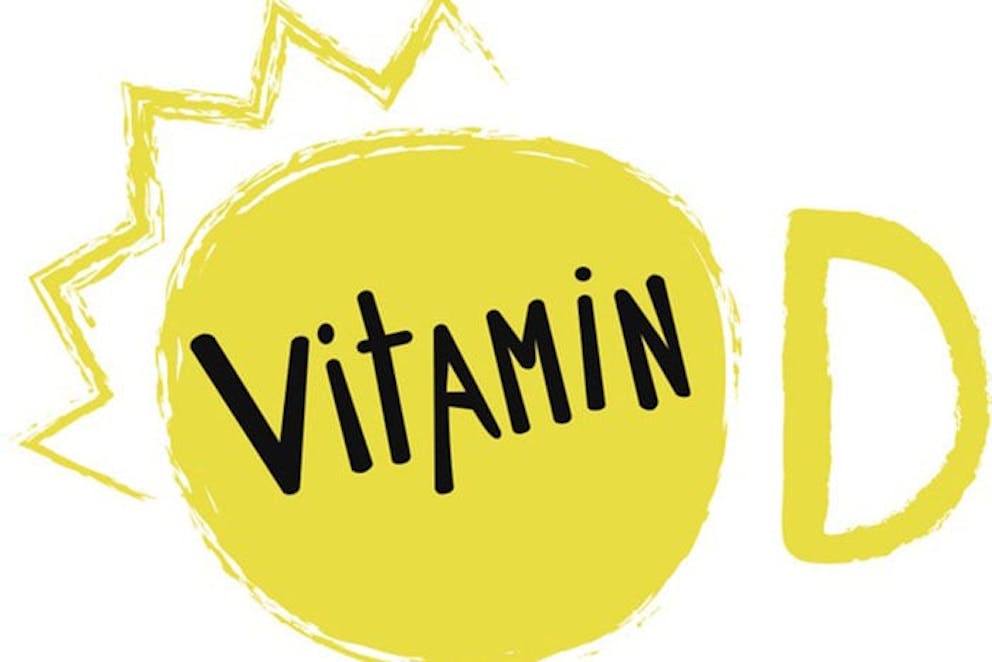 Vitamin D icon with yellow sun shape and vitamin D text on white background.