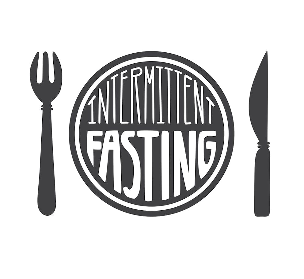 a black and white drawing that says intermittent fasting on a plate