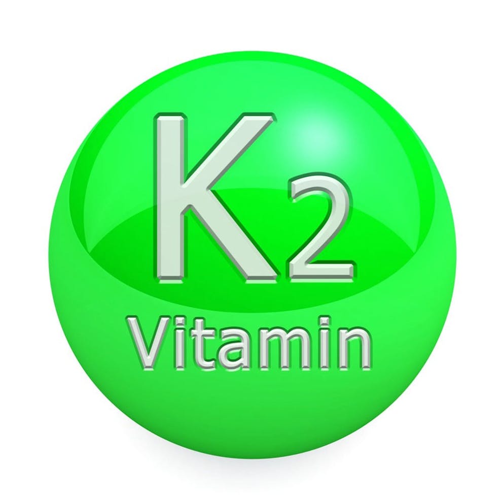 Vitamin K2 image bright green circle essential nutrient.