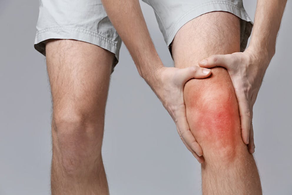  Man with knee inflammation | The Two Causes of Inflammation