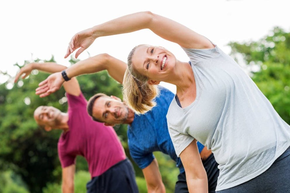 Mature healthy people doing stretching at park | The Unique Benefits Of Cranberries! | unsweetened cranberry juice | sugar free cranberry juice