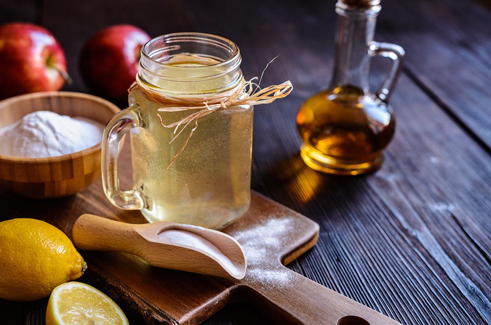 a jar with shake made of apple cider vinegar and lemons