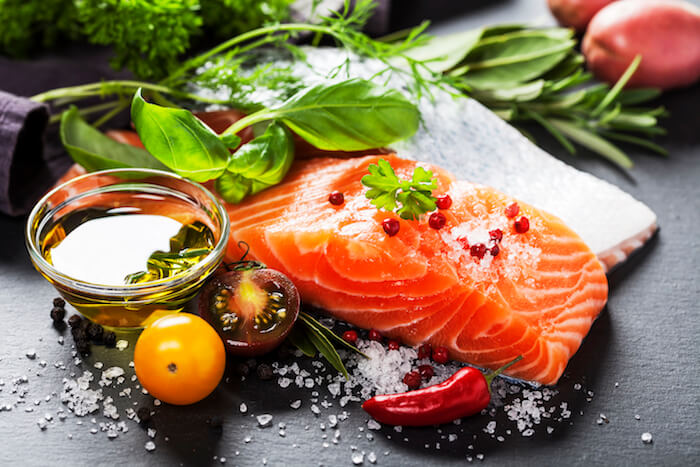 Organic salmon fish, olive oil, and spices on table |  What Fish Should I Eat to Avoid Mercury
