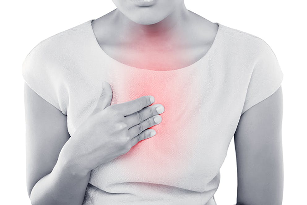 a woman suffering from acid reflux