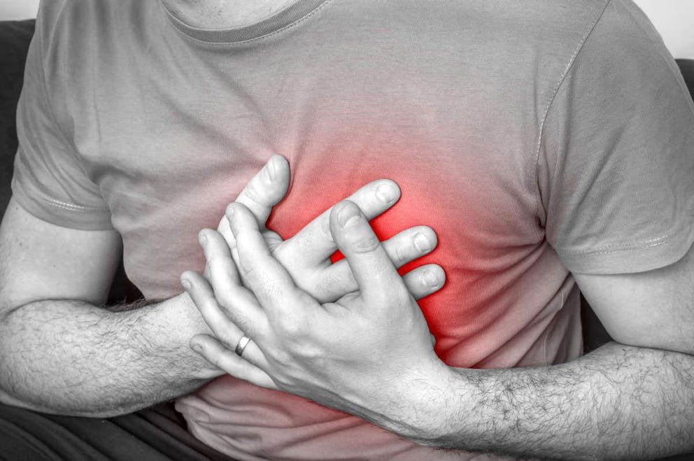 Man having chest pain | Alkaline Water Side Effects: Here's Why You Should NOT Drink It! | artificial alkaline water