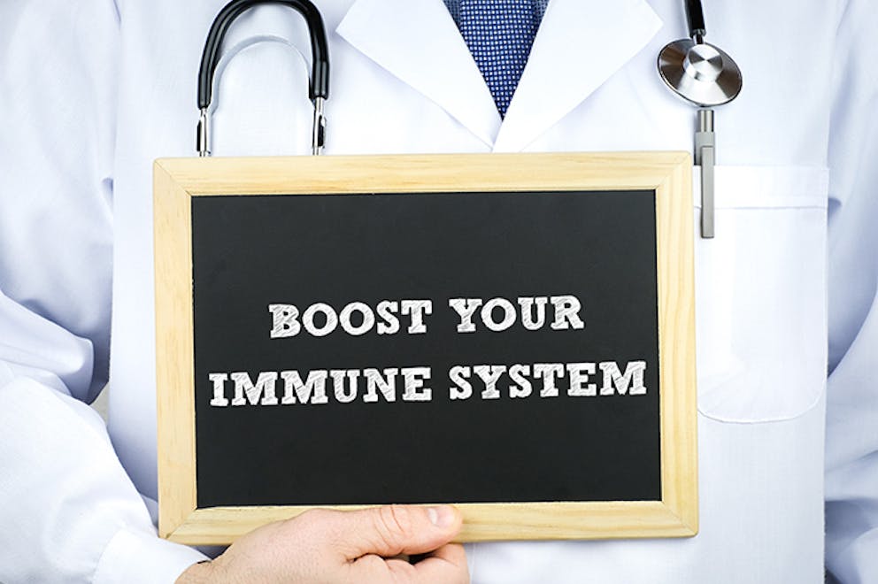 a chalkboard sign that reads Boost Your Immune System