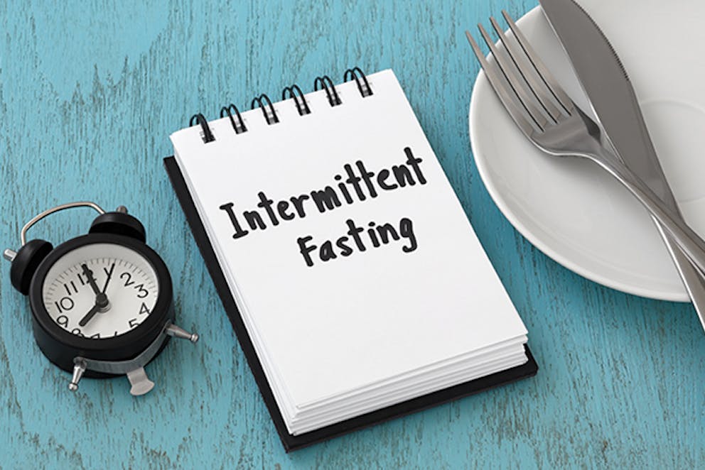 a hand lettered sign that reads Intermittent Fasting