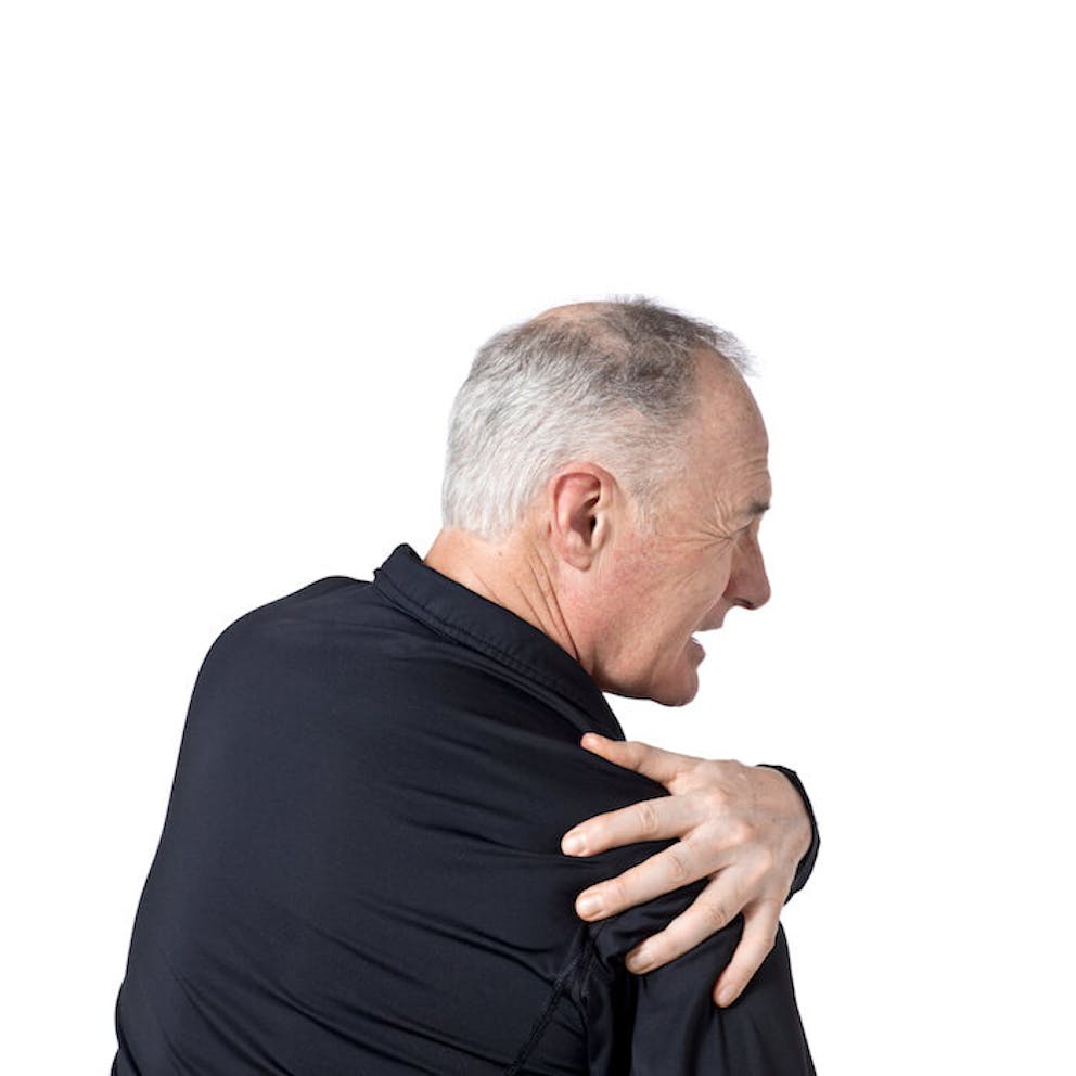 An older man grabbing his right shoulder in pain  | Your Liver is Triggering Your Right-Sided Shoulder Blade Pain
