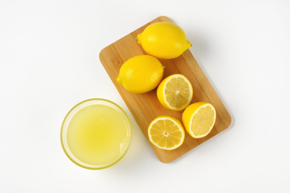 Freshly squeezed lemon juice and lemons