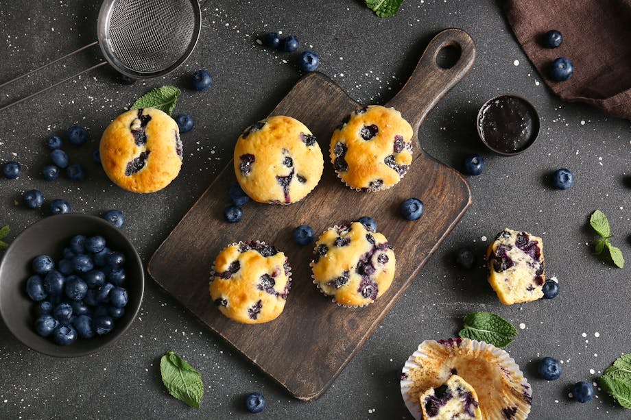 Blueberry muffins on wooden tray