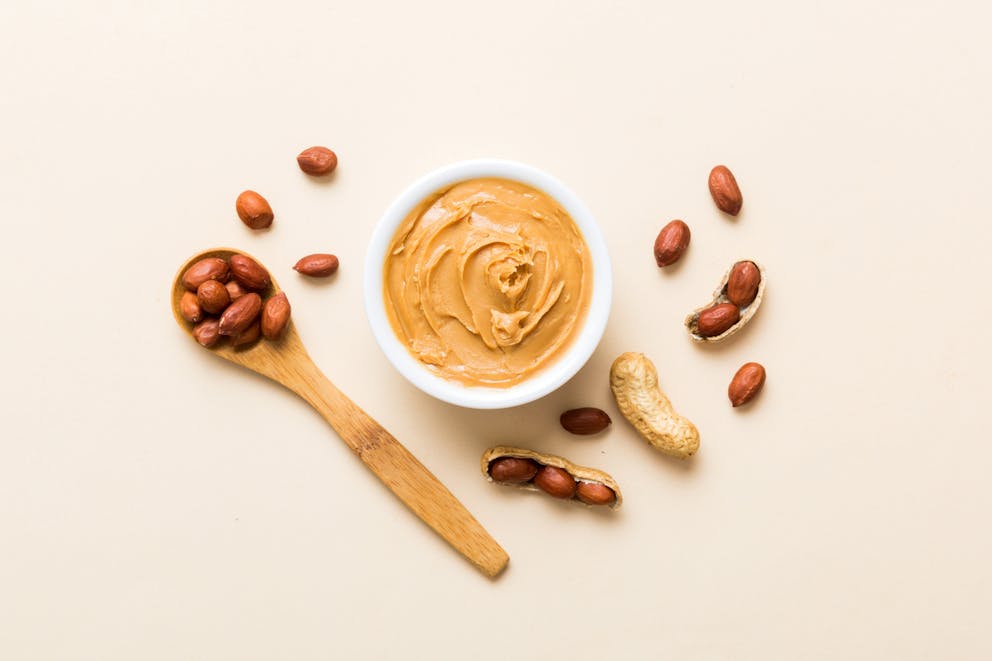 Bowl of peanut butter and peanuts