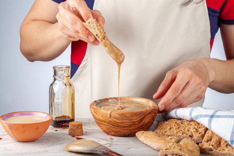 Dipping keto bread in tahini dip