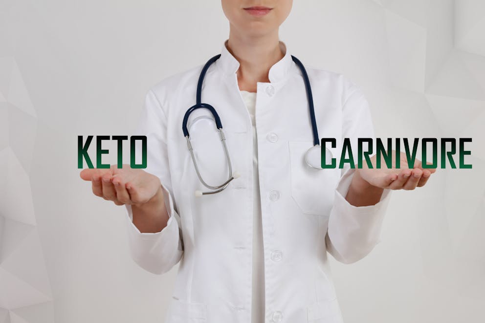 Woman holding carnivore diet vs keto diet sign
